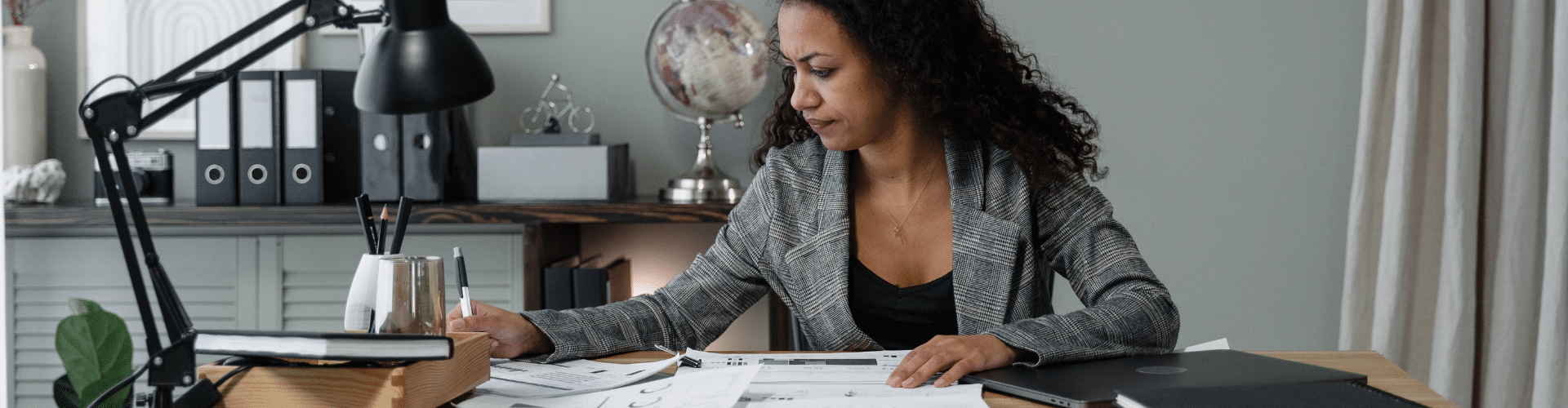 Stressed business owner working on documents related to ERC filings.